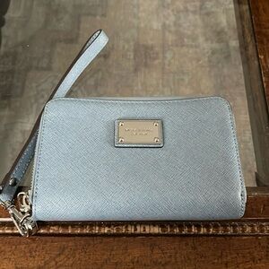 Blue and silver Michael Kors wristlet in new condition